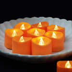 Homemory_Halloween_12_Pack_Orange_Tea_Light_Candles,_Battery_Operated_LED_Tealights,_Small_Pumpkins_Lights,_Flameless,_Electric_Fake_Tea_Candles,_1.4