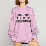 Surviving Fatherhood One Beer At A Time Funny Dad T-Shirt - Great Father's Day Gift Sweatshirt/Hoodie